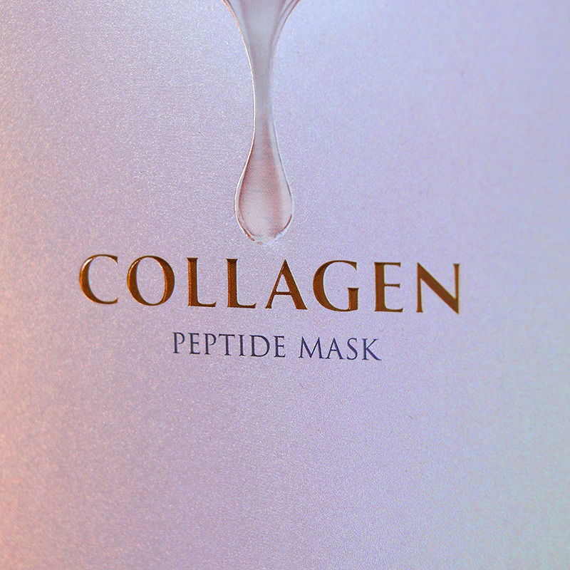 Maschera di cartone per la cura della pelle, trucco, confezione in scatola con superficie colorata e luccicante.